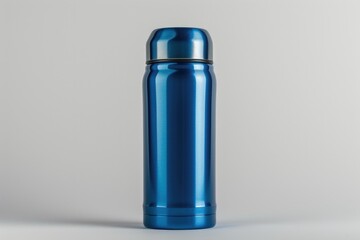 Poster - Blue thermos bottle placed on a clean white surface. Suitable for use in outdoor activities, travel, or for keeping beverages hot or cold