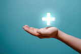 Fototapeta  - Hand Holding Cross, Symbol of Faith and Belief
