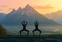 Pair Practicing Sunrise Yoga, Mountain Vista In Front, In Peaceful Poses