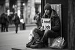 man on the street with a sign that says: I need a job