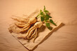 Korean ginseng root and some ginseng slices decorated on beige background.