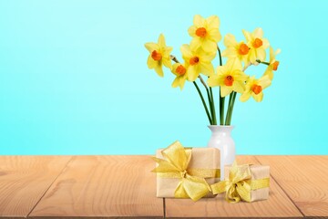 Poster - Gift box with fresh flowers in vase.