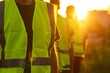 bright reflective vests stand out in fading sunlight