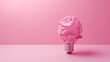 © Femmes.Digital - Crumpled paper light bulb on pastel pink background. Pink ECO energy idea concept. Copy space.
