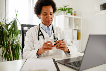 Wall Mural - Portrait of a female doctor at her office