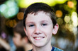 © Austockphoto - Portrait of a happy eleven year old boy with blurred background