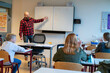 © Connect Images - teenage students in class concentrating on their teacher