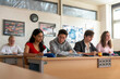 © Connect Images - Mix nationality students in a european classroom studying
