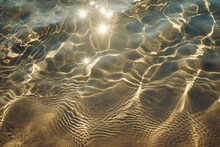 Sun Lights Shadow In Wavy Water On Abstract Sand Background