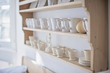 Interior still life of white interior decorated house in a shabby chic style.
