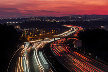 Elevated View Of The AP-7 Motorway At Dusk As It Passes Through Mollet Del Valles In The Province Of Barcelona In Catalonia Spain