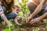 Fototapeta Miasta - A family planting a tree together Symbolizing the importance of legacy Love And the nurturing of life and nature for future generations