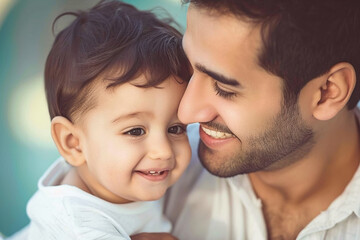 A happy young father in white clothes hugs his little son. Father's day concept.