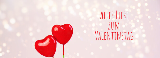 Wall Mural - Happy Valentine's Day greeting card with German text - Alles liebe zum Valentinstag -Two red ballon hearts with bokeh lights - love background