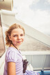 © MACO - Young girl with wind in her hair aboard a ferry. Corsica, France