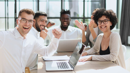 Smiling professional business leaders and employees group team portrait