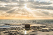Landscape image of coast and ocean in the background with beautiful light coming through the clouds. Byblos, Lebanon