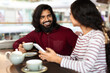 © Prostock-studio - Beautiful young indian couple have romantic date at cafe
