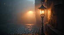 Street Lamp In Fog On Cobblestone. The Concept Of Mystery And Solitude.
