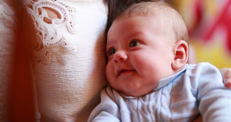 Wall Mural - Baby smiling and feeling joy interaction with adult