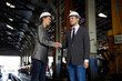 © offsuperphoto - businesspeople shaking hands before start work at construction site