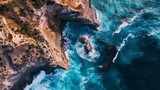 Fototapeta Morze - Remote coastline captured from an aerial perspective, rugged cliffs meeting the vast expanse of the ocean, waves crashing against the shore
