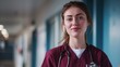 © Salander Studio - a female nurse wearing magenta colored scrubs in a hospital