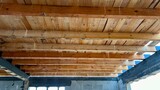 Fototapeta Krajobraz - New wooden ceiling on the new house built in progress. Wooden construction upon the first floor.