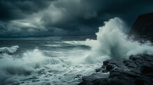 A Powerful Image Of Crashing Waves On A Rugged Coastline Under A Stormy Sky.