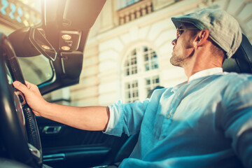 Wall Mural - Man Driving Convertible in Front of His Mansion