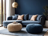 Fototapeta  - Two knitted pouffes near dark blue corner sofa design. Scandinavian home interior design of modern living room design.
