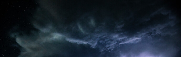 Wall Mural - a night sky with a cloud