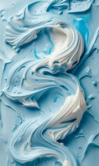  Abstract pattern of whipped blue and white cream, resembling waves.