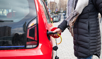 charging an electric car on the street