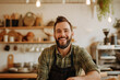 © Ishra - business owner testimonial image, smiling young businessman wearing an apron in the shop, indoor food and beverage photography  with co worker standing in the shop wearing an apron wallpaper concept