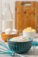 Wall Mural - Ingredients to prepare cake. Wheat flour, eggs, butter and milk.