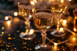 party, celebration and holidays concept - close up of champagne in glasses, electric garland lights and golden confetti on table over black background