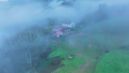 Wall Mural - Aerial drone view of the winter landscape around the town of Gainza and Amezqueta and the Txindoki Mountain. Aralar Mountain Range. Goierri region. Gipuzkoa. Basque Country. Spain. Europe