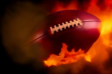 Wall Mural - American football ball in flames on black background, sports and leisure concept.