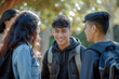© Oliver Evans Studio - group of hispanic teenagers talking smiling happy friends boys girls in a park sunlight outdoors jackets bright complicity bond friendship enjoying cheerful upbeat youth joy joyful students friendship