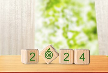 Wall Mural - New Year 2024 goal development concept on wooden cubes