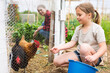 © JackF - Little girl feeding hen in a chicken pen on an organic farm on a sunny summer day