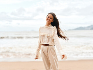 Wall Mural - Beauty of Summer's Sea: Young Lady Embracing Outdoors at the Beach