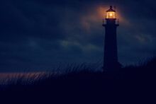 A Lighthouse With A Light On Top