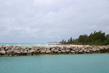 Wall Mural - Waves crashing on the shore at a jetty