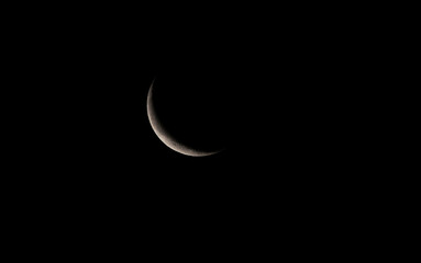 Wall Mural - half moon in the dark night sky. close-up view.