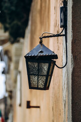 Wall Mural - Beautiful old lantern on an ocher wall in the center of Florence