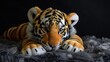 Stuffed animal in soft furry plush. Cute and adorable tiger animal toy.