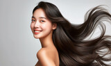 Fototapeta  - Portrait of a beautiful woman with a bright smile, hair is a beautiful black color, shampoo advertising concept Hair conditioner and cosmetic products,Generative AI