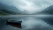  a small boat floating on top of a lake next to a lush green hillside covered in fog and low lying clouds on a foggy, overcast, overcast day.
